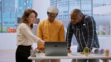 Realtor experts team meeting with entrepreneur to evaluate the office space layout, planning office relocation using architectural plans. Business woman shares her vision of the startup. Camera A. photo