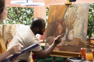 Painters team spend quality time on painting in their artistic studio, perfecting their latest masterpiece. Using multicolored pigments and innovative painting techniques to show their dedication. photo