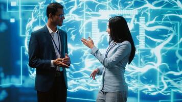 Computer scientists use AI neural networks modeled after human brain to solve complex problems. Startup employees using artificial intelligence to look at data and complete tasks, camera A photo