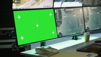 Soldier in military HQ base using green screen equipment to gather information on enemy troops. Officer using chroma key devices to do assessment of enemy vulnerabilities, camera A photo