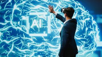 Computer scientist wearing VR headset looking at hologram of artificial intelligence human brain simulation. Indian man interacting with AI visualization showing machine learning algorithms, camera A photo