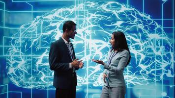 Computer scientists use AI neural networks modeled after human brain to solve complex problems. Startup employees using artificial intelligence to look at data and complete tasks, camera B photo