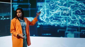 Speaker talking on stage in event bringing together leading experts, researchers, innovators and companies from around the globe to explore latest developments in AI and machine learning, camera A photo
