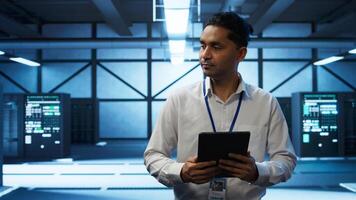 Security analyst in data center monitoring security threats, implementing cybersecurity measures. Expert ensuring compliance with regulations to protect data center assets, camera B photo