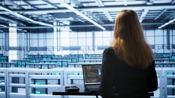 Person in data center works with artificial intelligence technology simulating human brain. Woman working on digital device with AI machine learning algorithms using pattern recognition, camera B photo