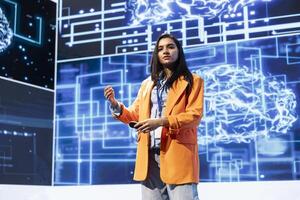 Technician presenting how artificial intelligence technologies can bring businesses increased productivity during IT expo. Expert talks about implementation of AI driven solutions during tech forum photo