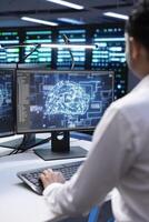 System administrator working in data center providing computing resources needed for artificial intelligence to process massive datasets. IT expert in server hub storing data used for machine learning photo
