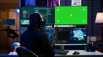 Cybercriminal using AI machine learning and isolated screen PC to develop system exploits. Hacker using artificial intelligence tech and mockup monitor to build script tricking firewalls, camera A photo