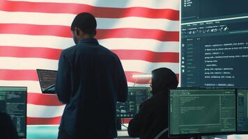 A technical team in a governmental cyber environment with the USA flag. Focus on cybersecurity strategy, threat management and secure operations for national security and digital defense. Camera A. photo