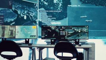 Federal agency control room equipped with surveillance and radio system to oversee threats or danger on a world map. Military command center space with a dashboard and big data visualization. photo