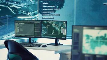 Empty military command headquarters with a big display and workstations used for reconnaissance and surveillance monitoring on a world map. Army intelligence gear and CCTV footage, federal agency. photo