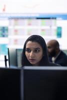 General manager working on data management with infographics and business activity reports, ensuring objective achievement. Shareholder reviewing an investment for global expansion. photo