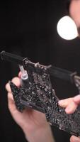vertical Close-up of dust flying from a computer board video