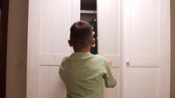 boy found ghost in closet. Child playing hide and seek with ghost in wardrobe video