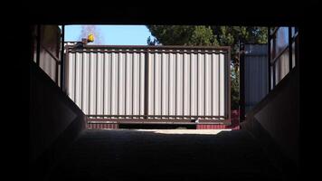 automatic rc gates to the garage open and the car enters a private parking space video