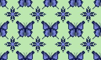 a detailed pattern composed of pixel designs with blue flowers and blue butterfly on green background , design for fabric or various pattern printing works. vector