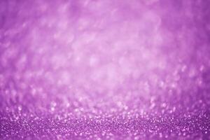 Abstract purple glitter background thin focus part and defocus lights. Sequins are purple. photo