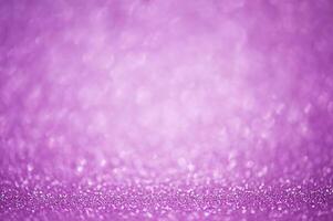 Abstract purple glitter background thin focus part and defocus lights. Sequins are purple. photo