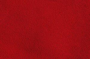 Red suede background macro photo. Suede texture. photo
