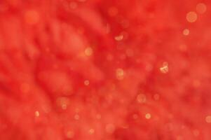 Red abstract blurred background with yellow defocus lights photo