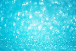 Defocus light background blue with white. Blurred glitters, sparkles shine, bokeh. photo