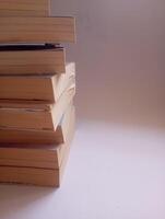 photo of a stack of books that have started to yellow