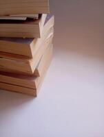 photo of a stack of books that have started to yellow
