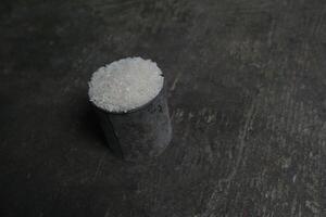 White rice in a rustic metal container. photo