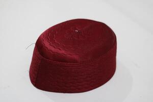 Red embroidered cap isolated on white background. photo