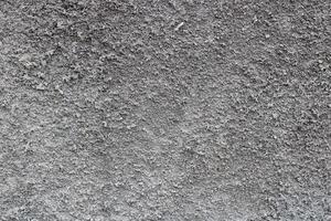 Rough textured grey wall surface. photo