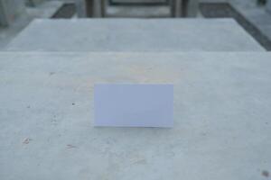 Blank card on a concrete surface. photo