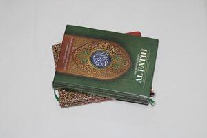 Close-up of a Holy Quran book with intricate designs. photo
