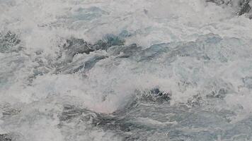 Close-up of churning water in rapid motion video