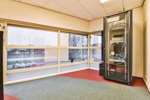 A room with a large window and a computer in it photo