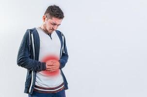 Unhappy man with digestive problems isolated. Person with digestive and stomach problems isolated photo