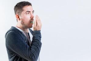 Person with bad breath problem isolated. Man with latisosis checking bad breath photo