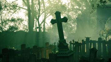 Mysterious graveyard shrouded in mist during twilight hours video