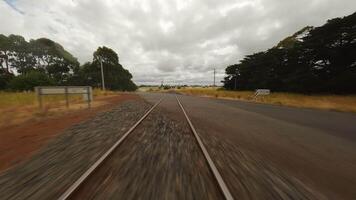 FPV drone flies over railway tracks. Sleepers and rails. video