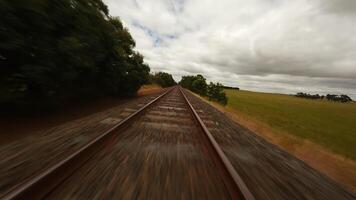 FPV drone flies over railway tracks. Sleepers and rails. video