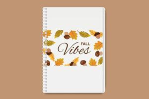 Autumn notebook with Fall Vibes typography, acorns, and colorful leaves on spiral bound cover vector
