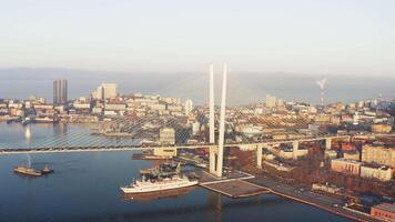 Beautiful autumn top view of cable-stayed bridge with hills at sunrise video