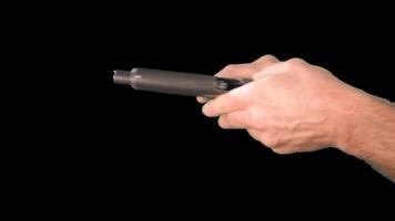 Male hands presenting weapons a gun. Alpha channel. Simulation of reloading weapons and shooting a pistol on a transparent background video