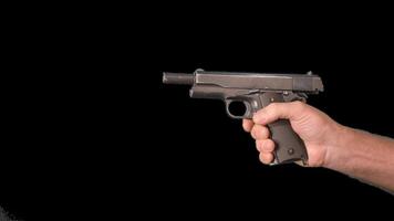 Male hands presenting weapons a gun. Alpha channel. Simulation of reloading weapons and shooting a pistol on a transparent background video