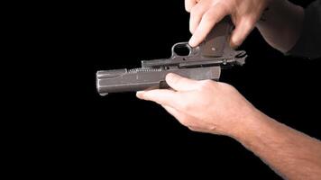 Male hands presenting weapons a gun. Alpha channel. Simulation of reloading weapons and shooting a pistol on a transparent background video