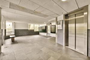 An elevator in a building with a tile floor photo