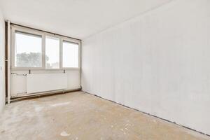 Empty room with white walls and a window photo