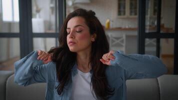 Caucasian sad upset stressed tired exhausted fatigued overworked Caucasian woman stretch at home couch relax stretching arms hands at sofa female girl sleepy lady health problem bad feeling unhealthy video