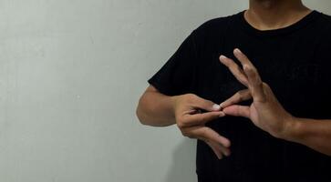 young man using sign language interpreter to communicate photo