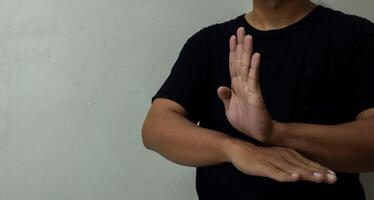 young man using sign language interpreter to communicate photo