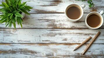 Two cups of coffee on a rustic wooden table near a window with potted plants in a cozy setting photo